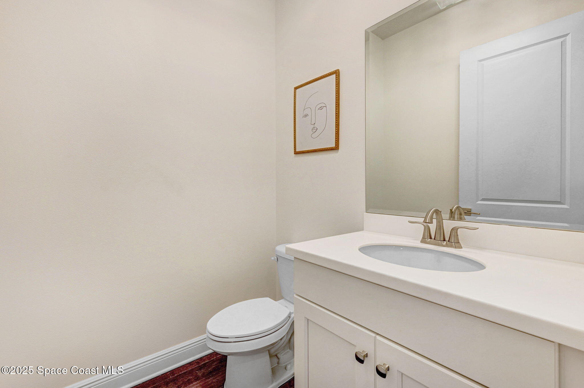 2366 Addison Drive Melbourne, FL 32940 - Photo 37 of 43 a bathroom with a sink a toilet and mirror