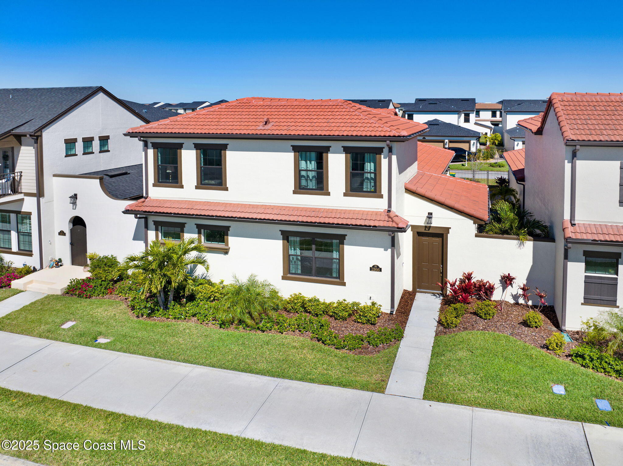 2366 Addison Drive Melbourne, FL 32940 - Photo 4 of 43 a front view of a house with a yard