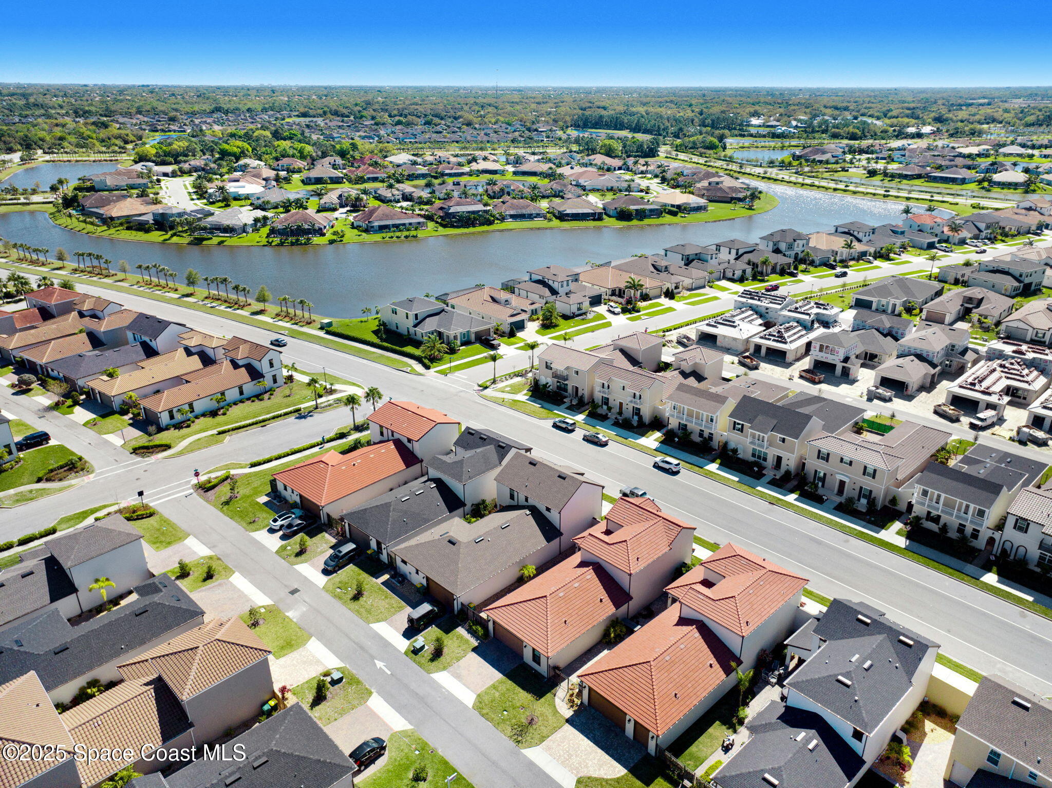 2366 Addison Drive Melbourne, FL 32940 - Photo 10 of 43 an aerial view of a city with lake view