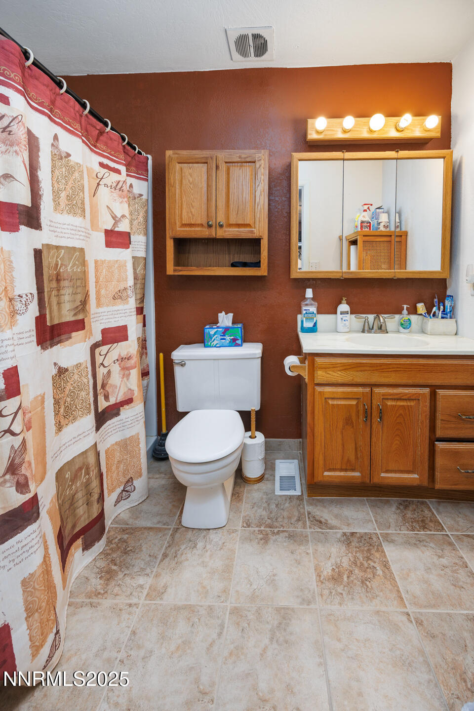 3395 Duane Drive Fallon, NV 89406 - Photo 11 of 22 a bathroom with a toilet a sink and a large mirror