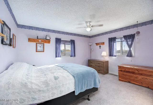 a bedroom with bed and window