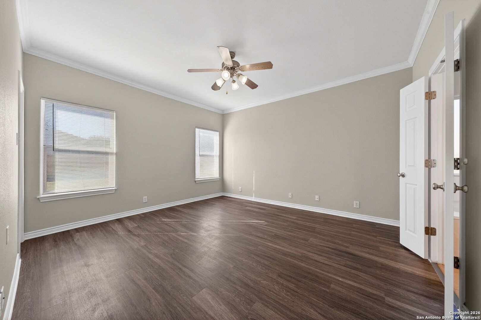 15709 Fair Lane Selma, TX 78154 - Photo 14 of 32 a view of an empty room with wooden floor and a window