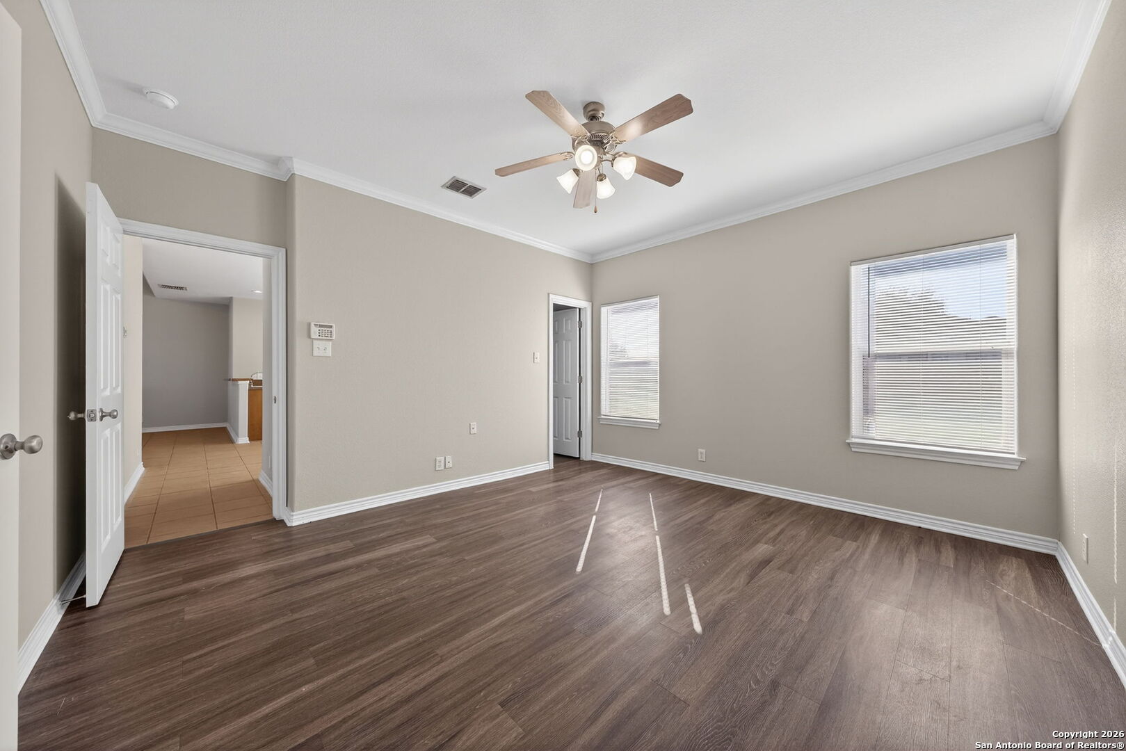 15709 Fair Lane Selma, TX 78154 - Photo 15 of 32 a view of an empty room with wooden floor and a window