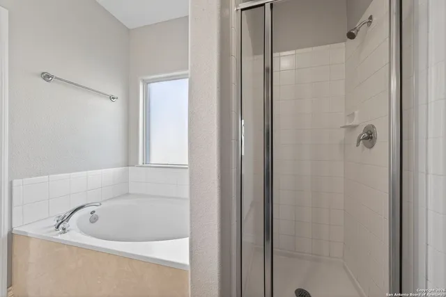 a white bath tub sitting in a bathroom
