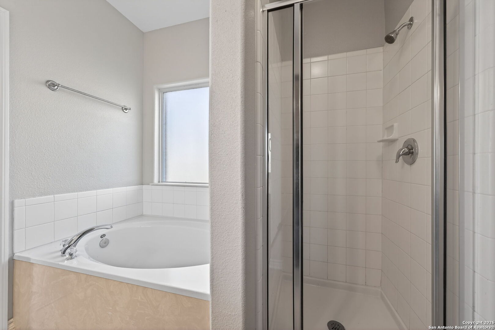 15709 Fair Lane Selma, TX 78154 - Photo 18 of 32 a white bath tub sitting next to a shower