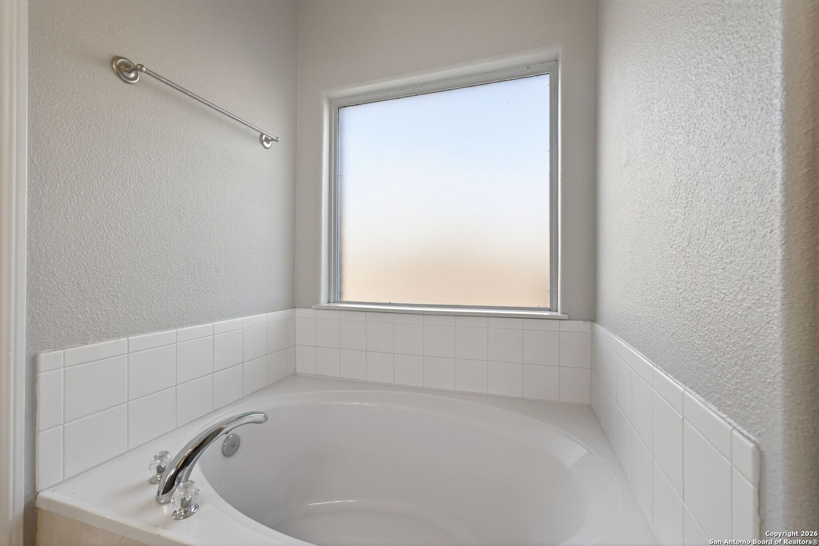 15709 Fair Lane Selma, TX 78154 - Photo 19 of 32 a white bath tub sitting in a bathroom