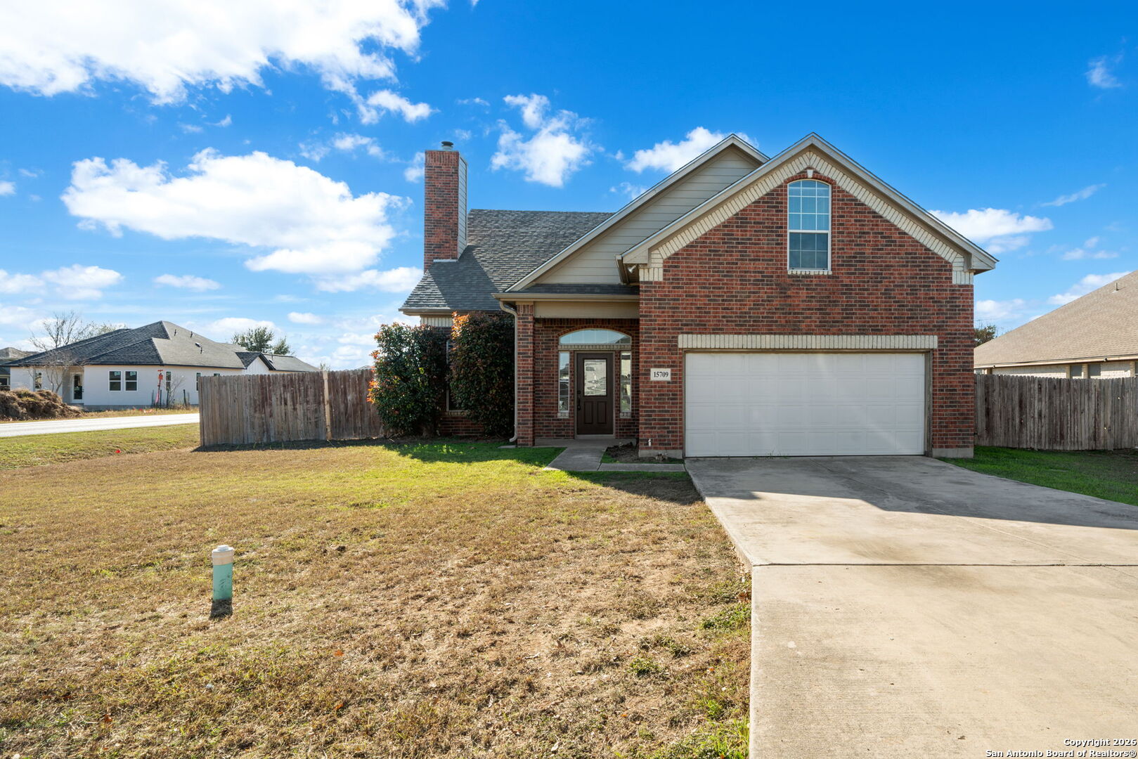 15709 Fair Lane Selma, TX 78154 - Photo 2 of 32 a front view of a house with a yard and garage