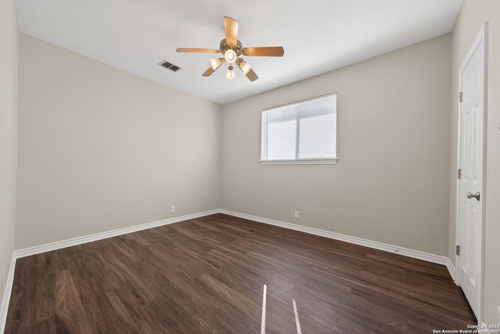 15709 Fair Lane Selma, TX 78154 - Photo 24 of 32 wooden floor in an empty room with a window