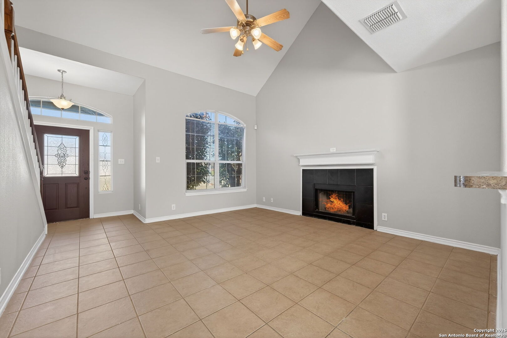 15709 Fair Lane Selma, TX 78154 - Photo 6 of 32 an empty room with windows and fireplace