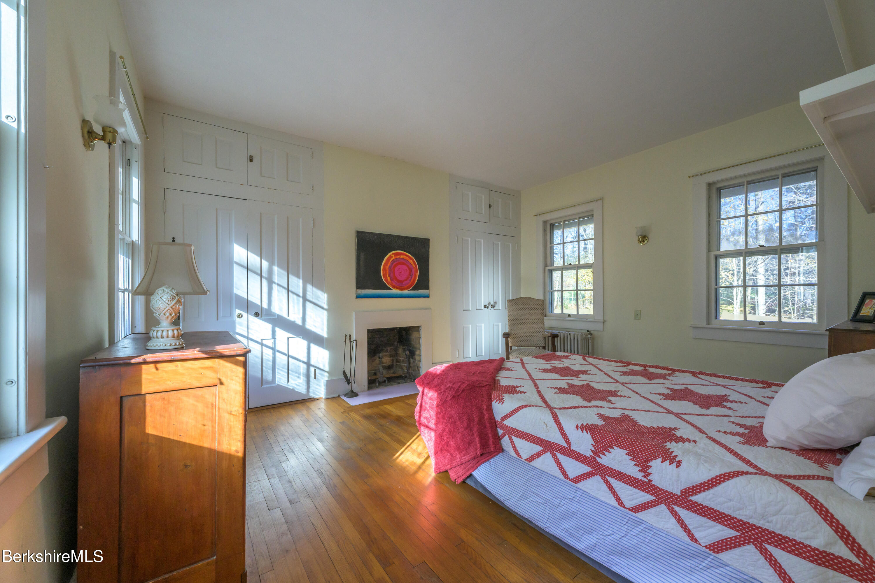 2 Cherry Street Stockbridge, MA 01262 - Photo 28 of 42 a bedroom with a bed and a fireplace