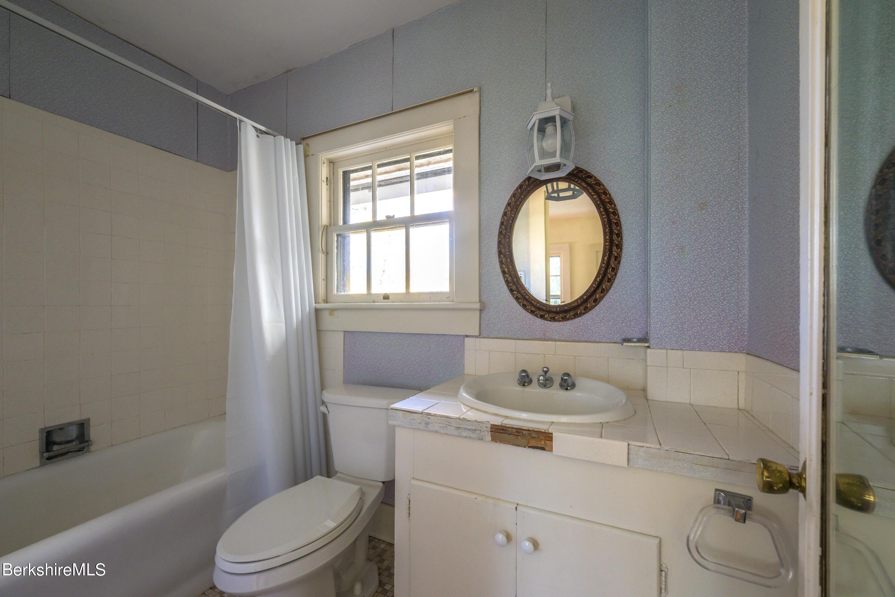 2 Cherry Street Stockbridge, MA 01262 - Photo 29 of 42 a bathroom with a toilet sink vanity tub and mirror