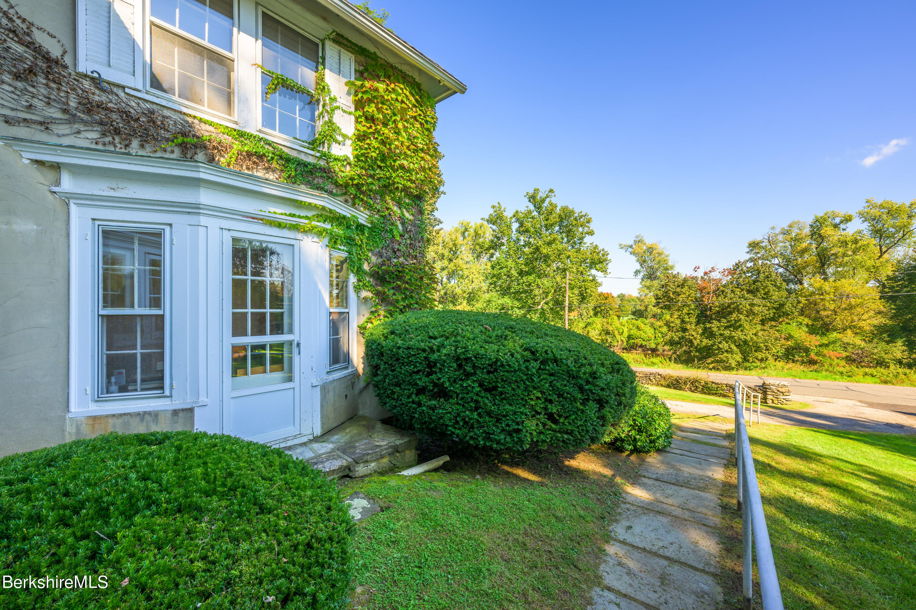 2 Cherry Street Stockbridge, MA 01262 - Photo 3 of 42 a view of a building with a garden