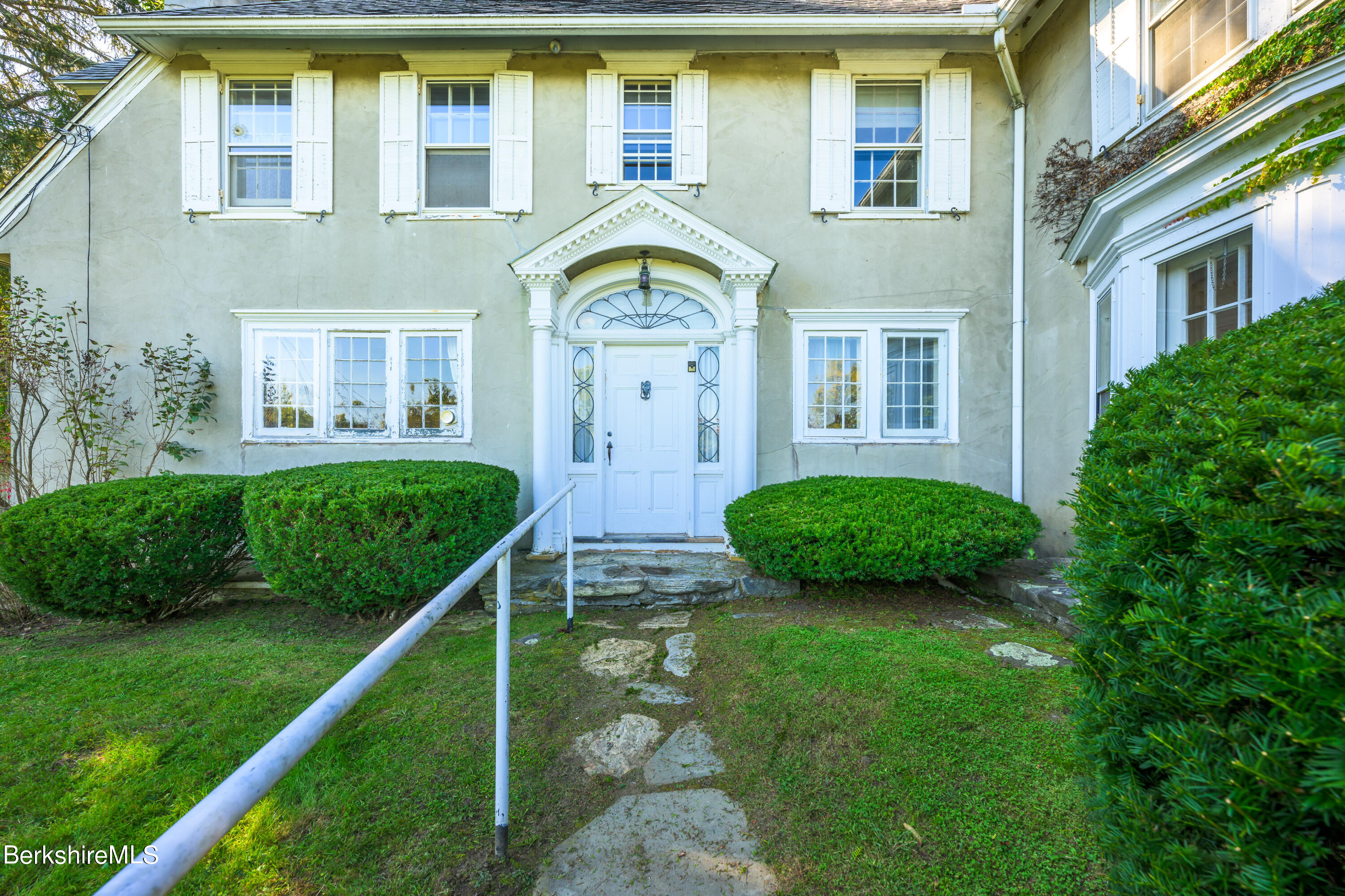 2 Cherry Street Stockbridge, MA 01262 - Photo 4 of 42 a front view of a house with garden
