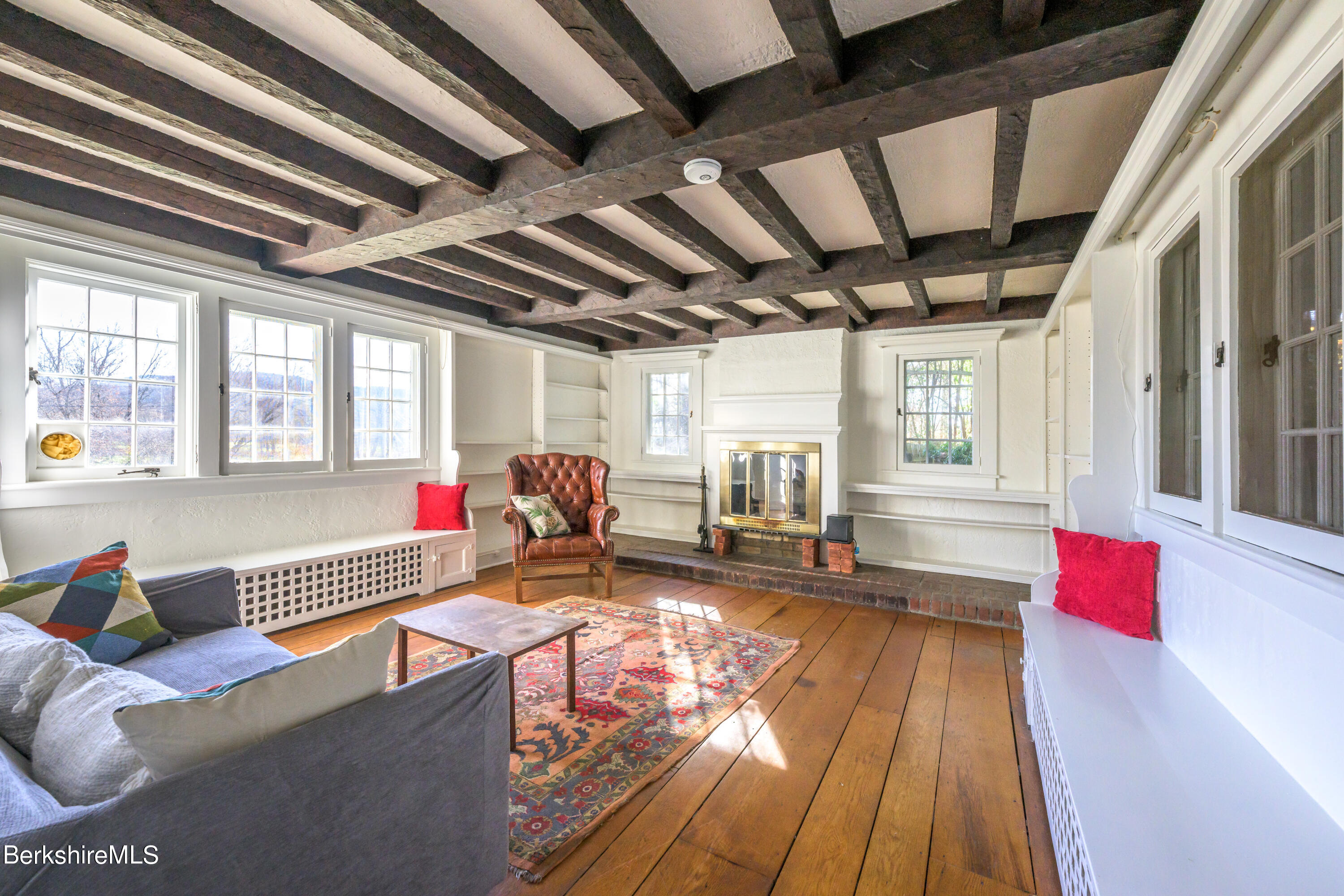 2 Cherry Street Stockbridge, MA 01262 - Photo 6 of 42 a living room with furniture stove and a table