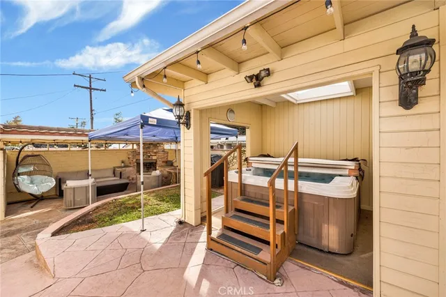 a view of a patio with table and chairs
