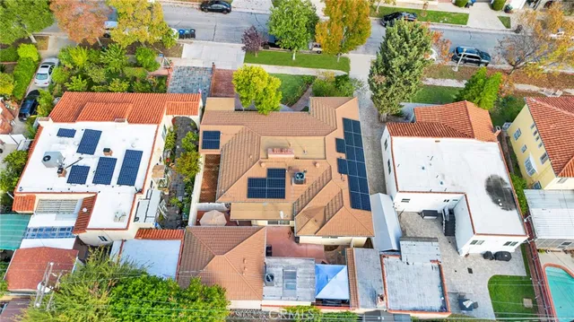 an aerial view of residential houses with outdoor space