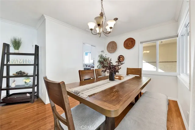 a view of a dining room and a table chairs