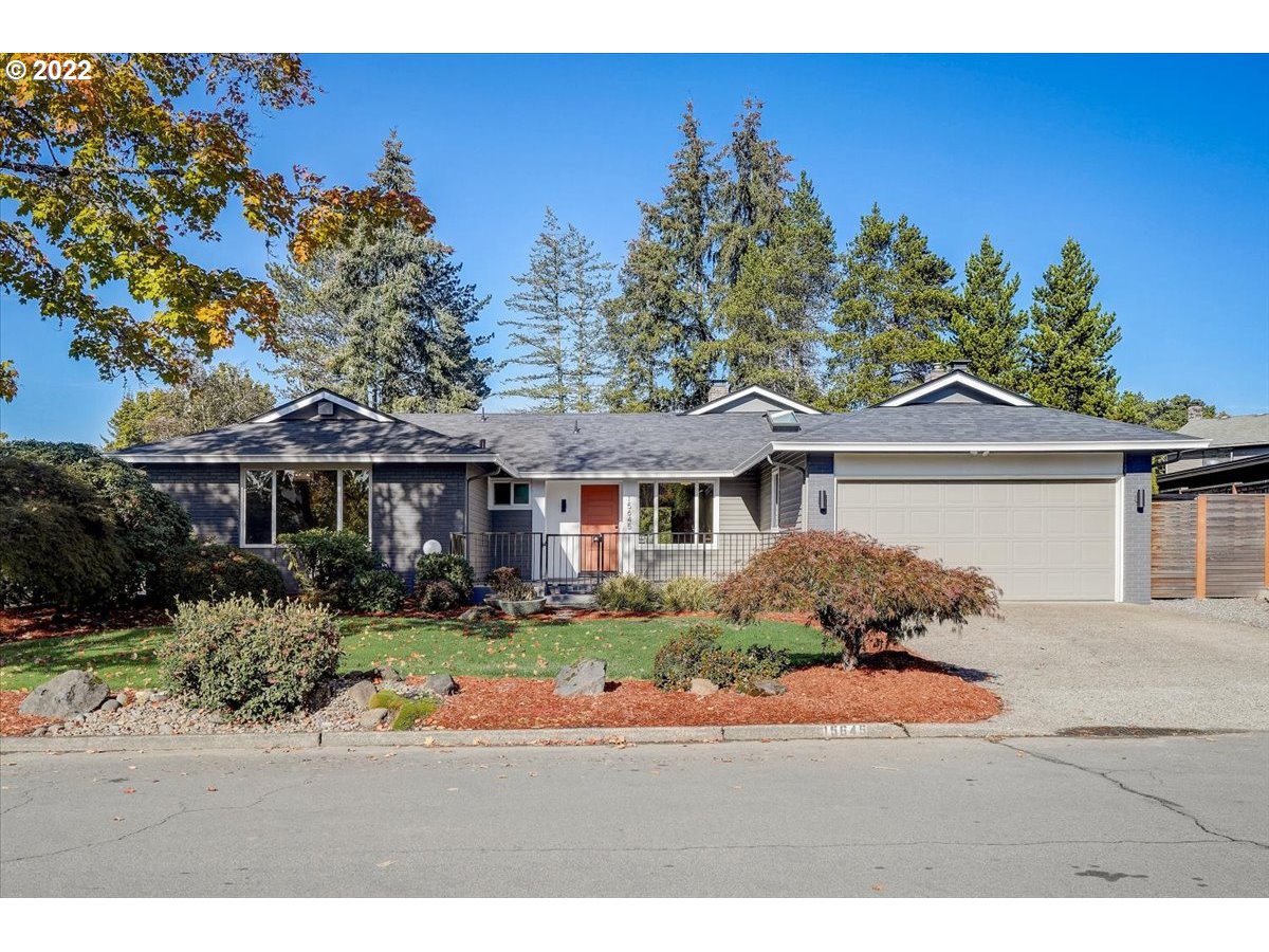 15645 Northwest Perimeter Drive Beaverton, OR 97006 - Photo 1 of 32 a front view of a house with a yard