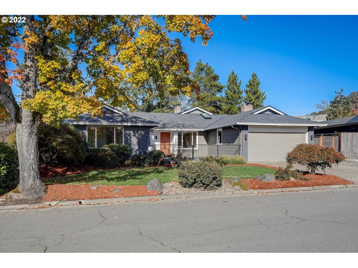 15645 Northwest Perimeter Drive Beaverton, OR 97006 - Photo 2 of 32 a front view of a house with a yard