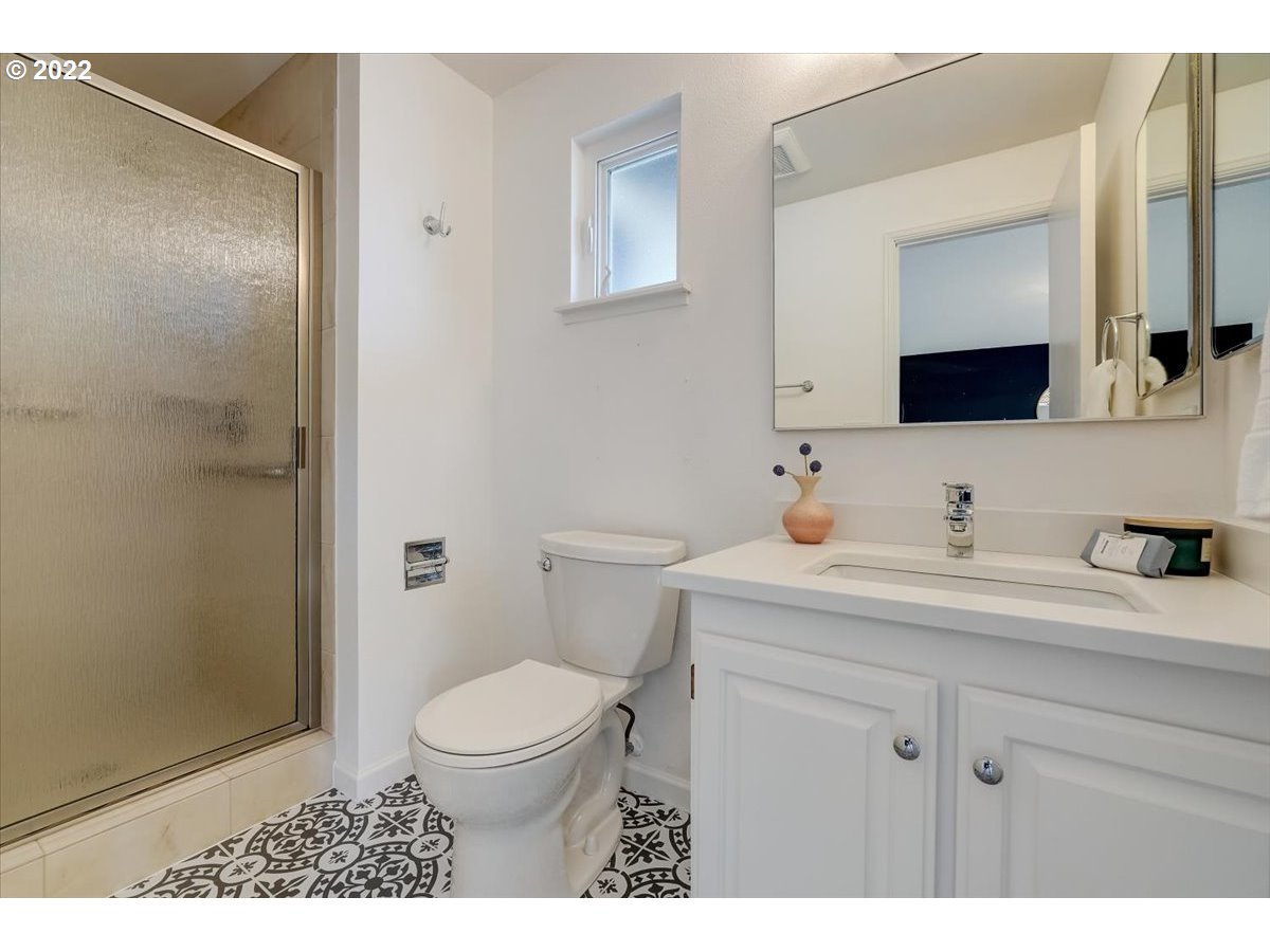 15645 Northwest Perimeter Drive Beaverton, OR 97006 - Photo 21 of 32 a bathroom with a sink a toilet and shower