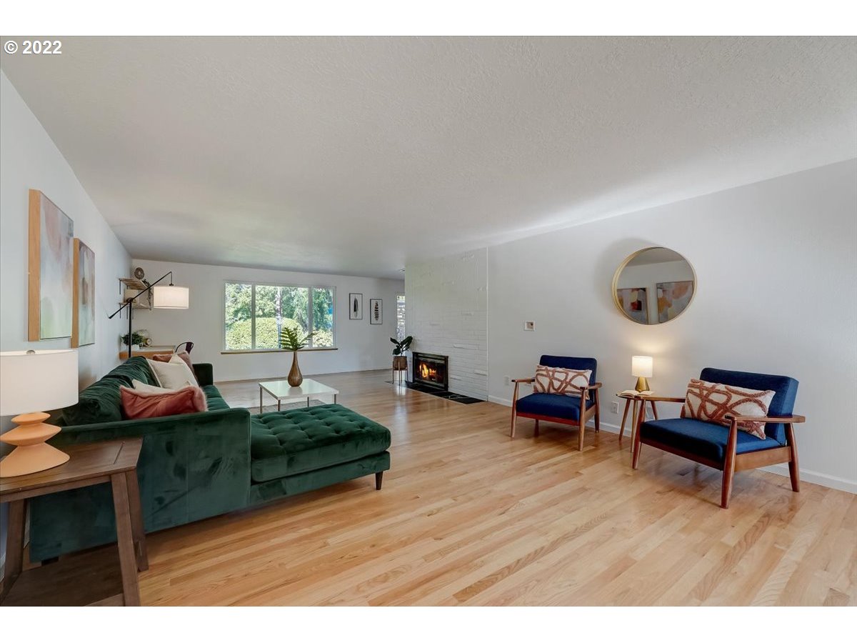 15645 Northwest Perimeter Drive Beaverton, OR 97006 - Photo 5 of 32 a living room with furniture and a wooden floor