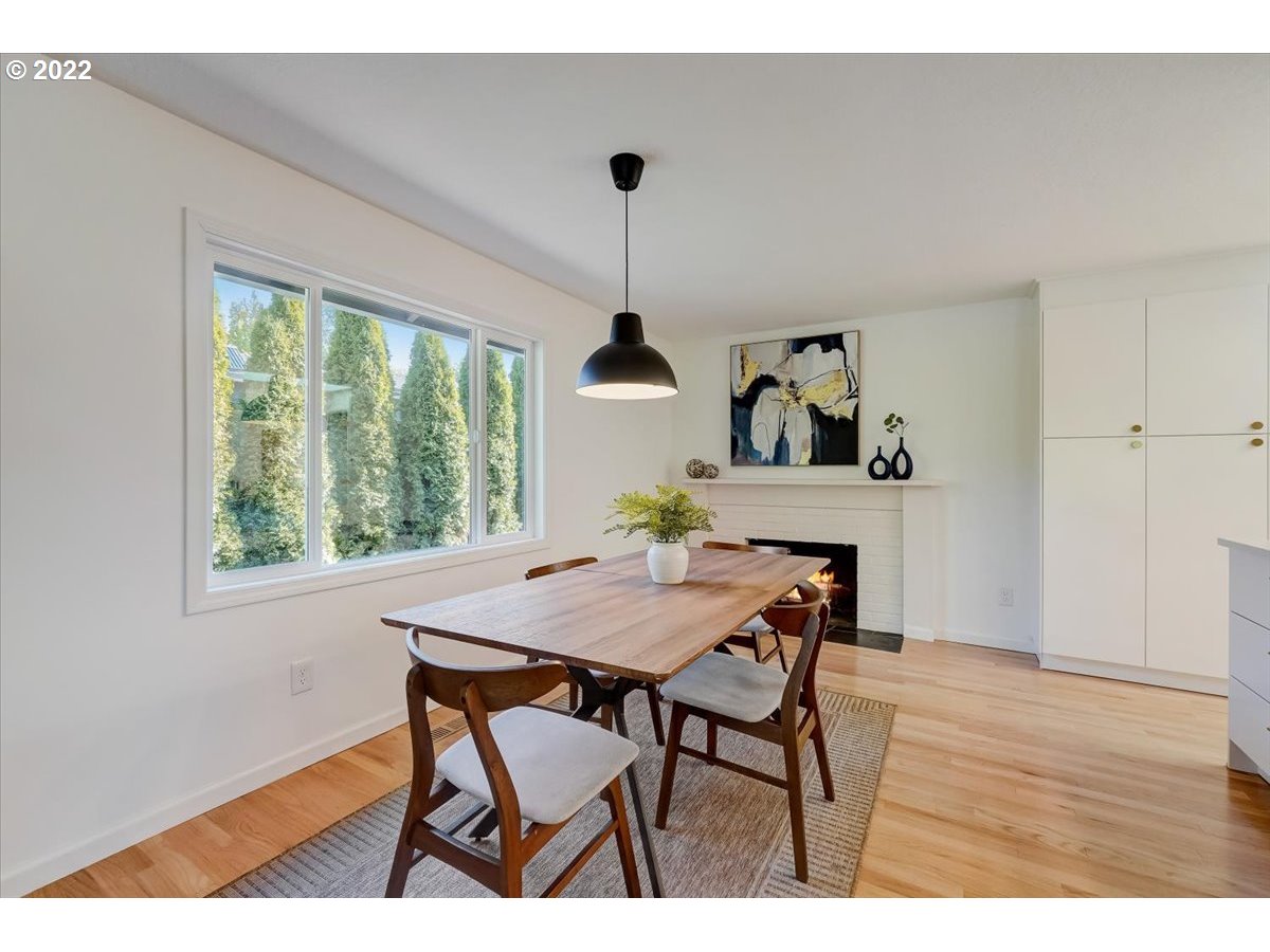 15645 Northwest Perimeter Drive Beaverton, OR 97006 - Photo 7 of 32 a view of a dining room with furniture window and wooden floor