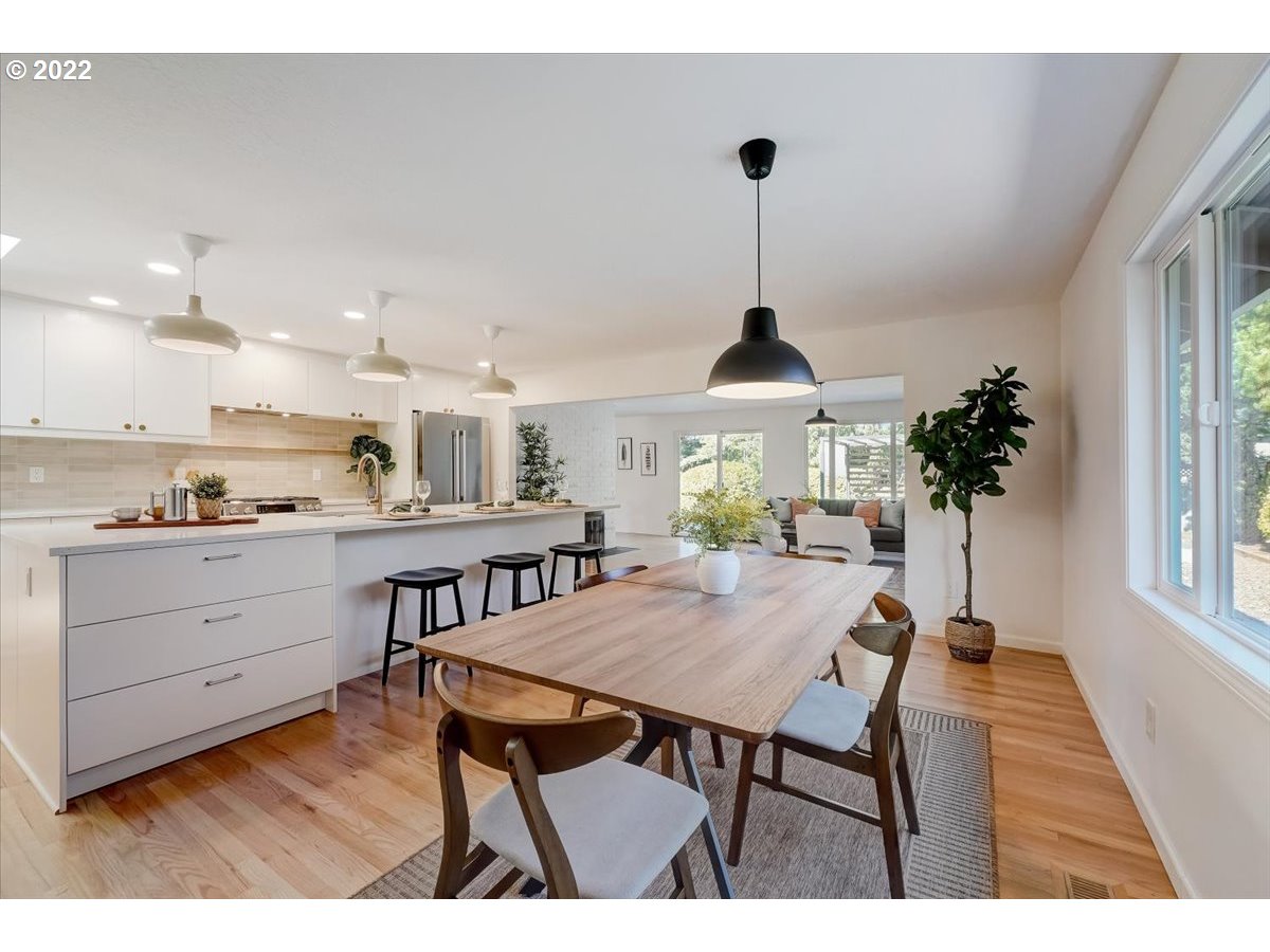 15645 Northwest Perimeter Drive Beaverton, OR 97006 - Photo 9 of 32 a open kitchen with dining table and chairs