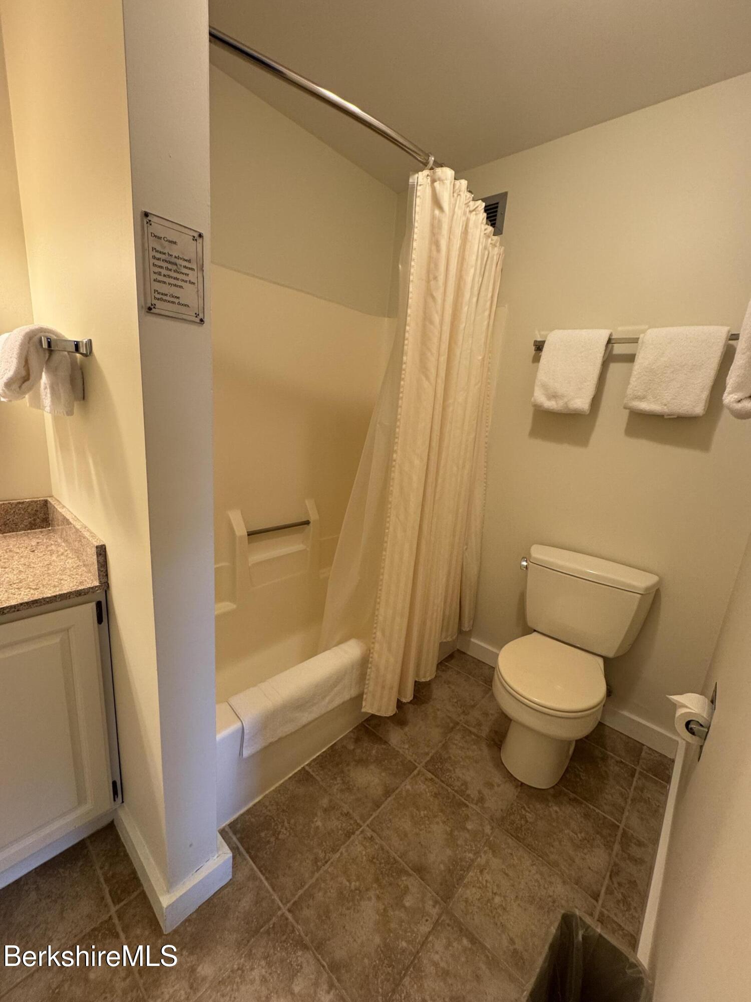 37 Corey Road, Unit 426 Hancock, MA 01237 - Photo 12 of 14 a bathroom with a toilet and a shower