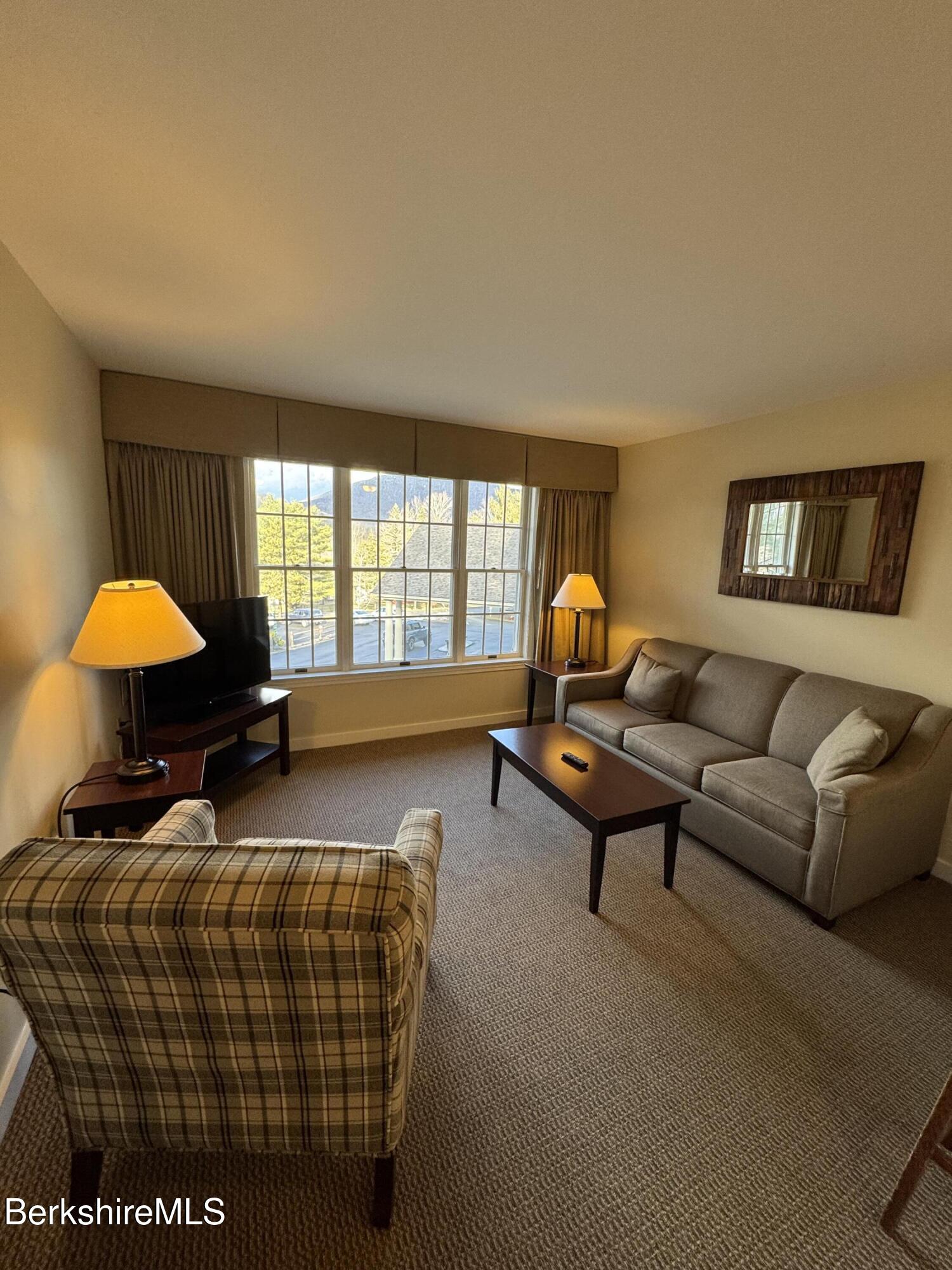 37 Corey Road, Unit 426 Hancock, MA 01237 - Photo 7 of 14 a living room with furniture and a window