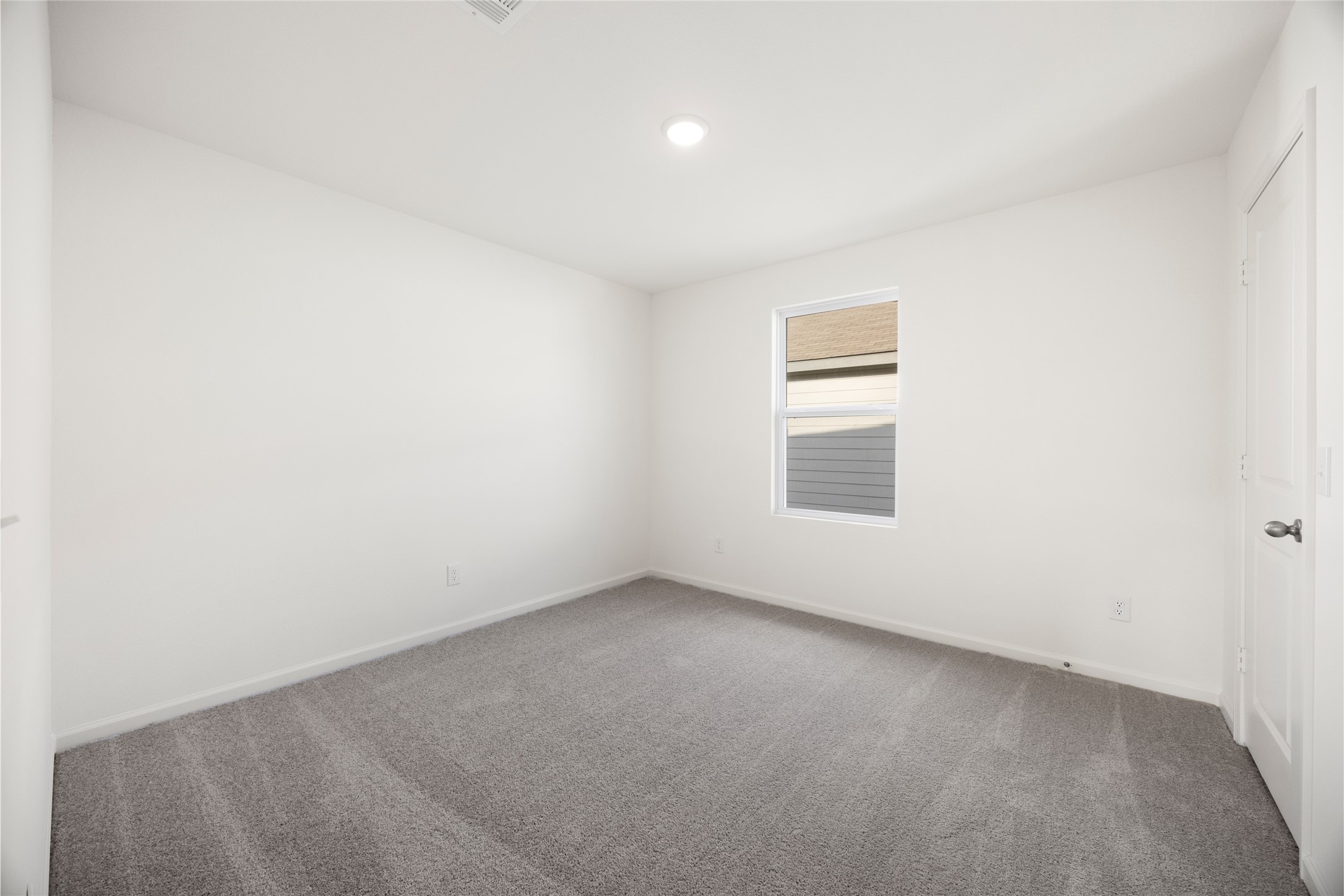 8807 Vacek Xing Way Richmond, TX 77469 - Photo 14 of 33 an empty room with a window