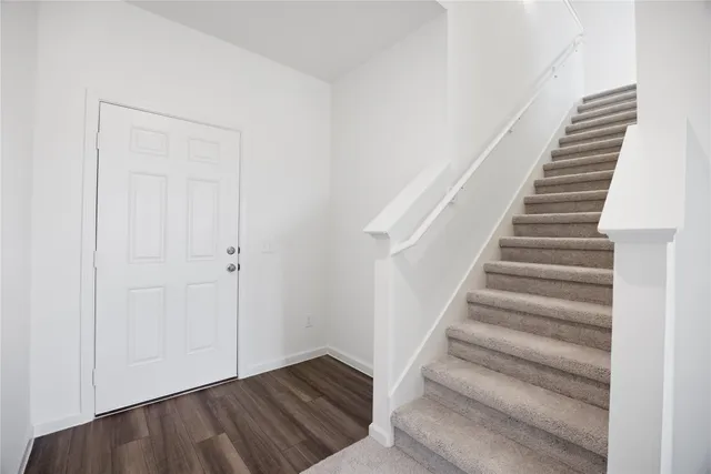 a view of entryway with wooden floor