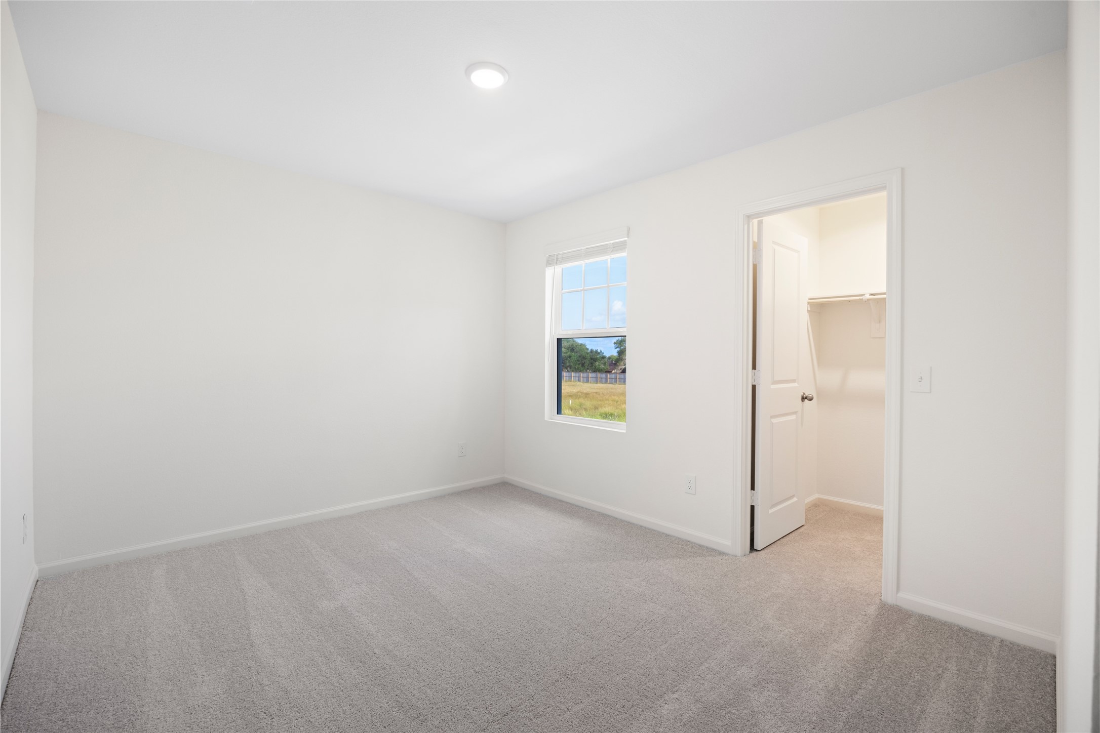 8807 Vacek Xing Way Richmond, TX 77469 - Photo 18 of 33 an empty room with a empty space and windows