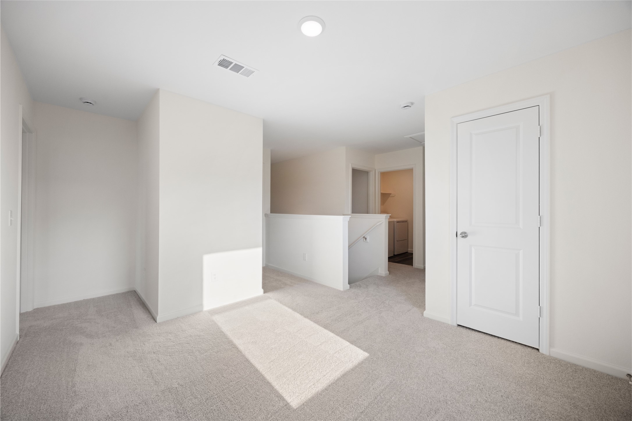 8807 Vacek Xing Way Richmond, TX 77469 - Photo 21 of 33 a view of a room with a hallway and stairs