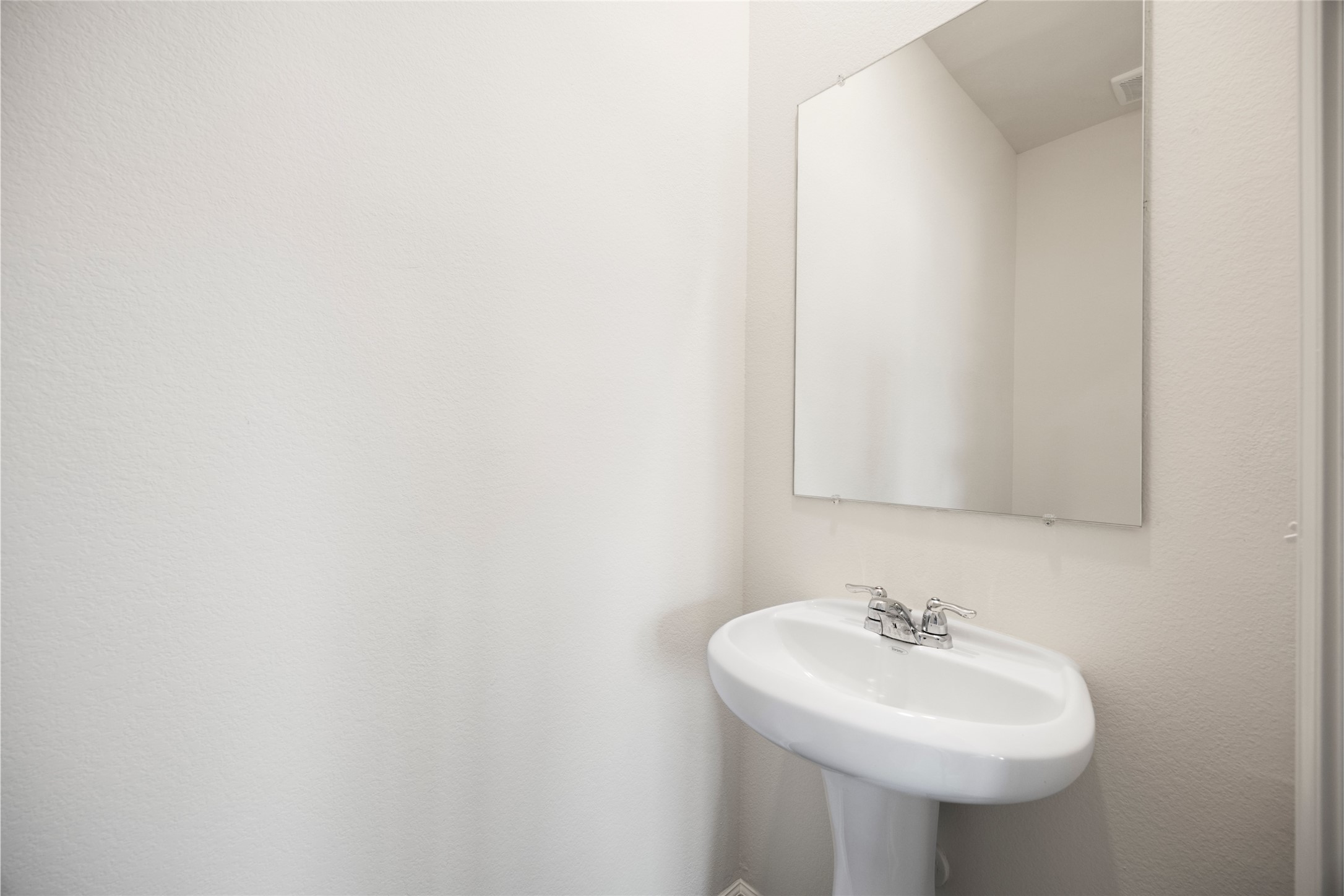 8807 Vacek Xing Way Richmond, TX 77469 - Photo 23 of 33 a bathroom with a sink and a mirror