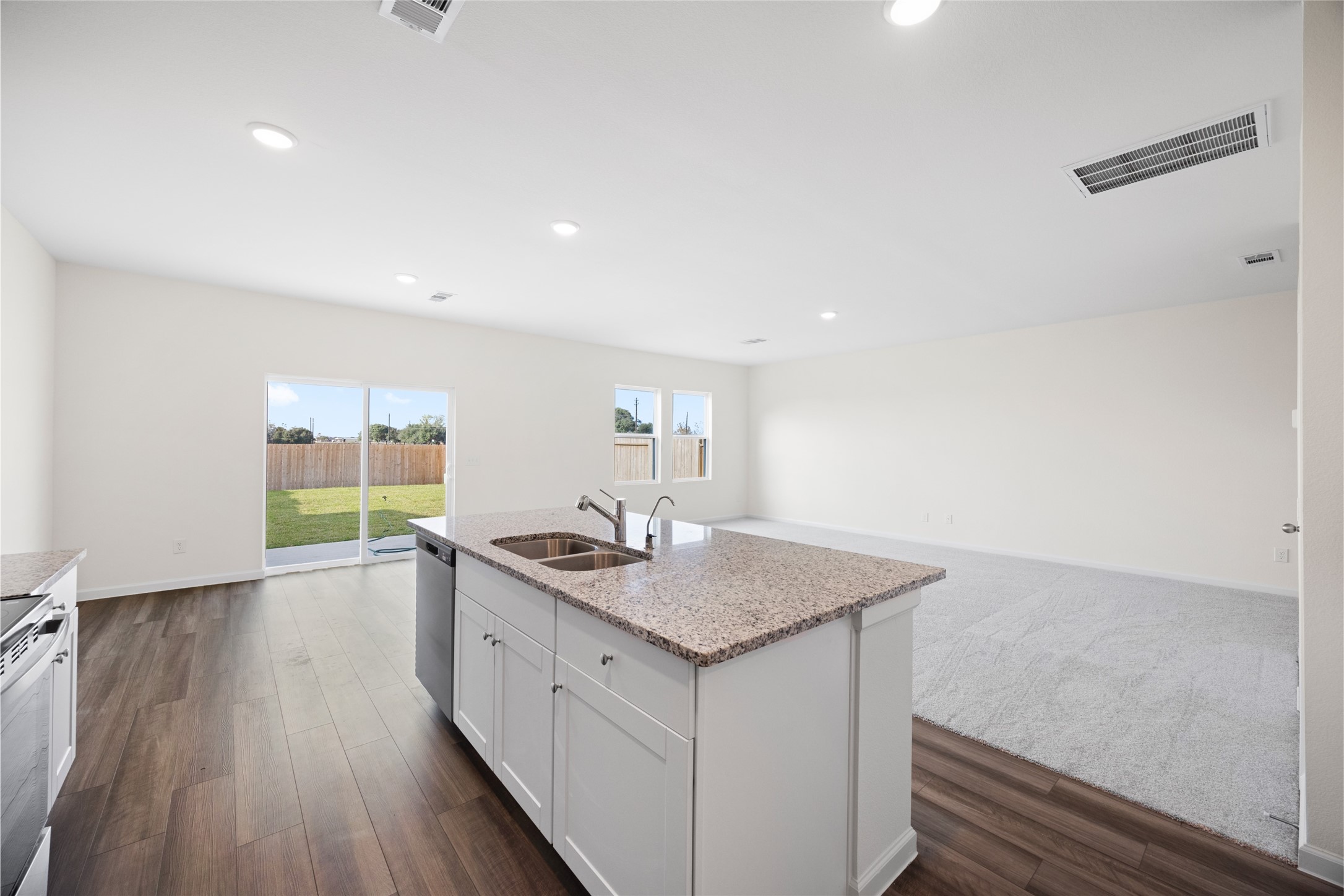 8807 Vacek Xing Way Richmond, TX 77469 - Photo 26 of 33 a kitchen with a sink stove and cabinets