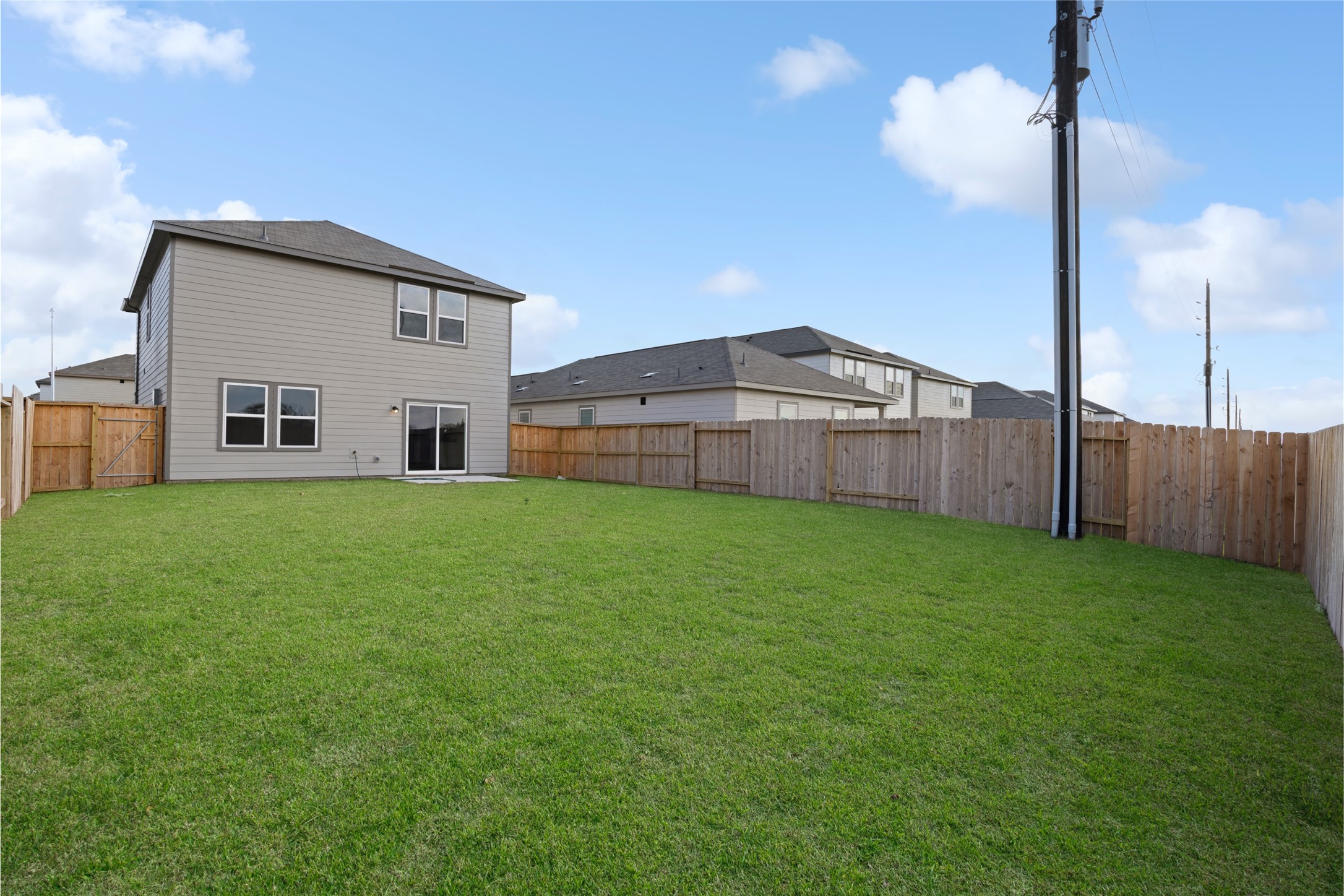 8807 Vacek Xing Way Richmond, TX 77469 - Photo 33 of 33 a view of a house with a backyard