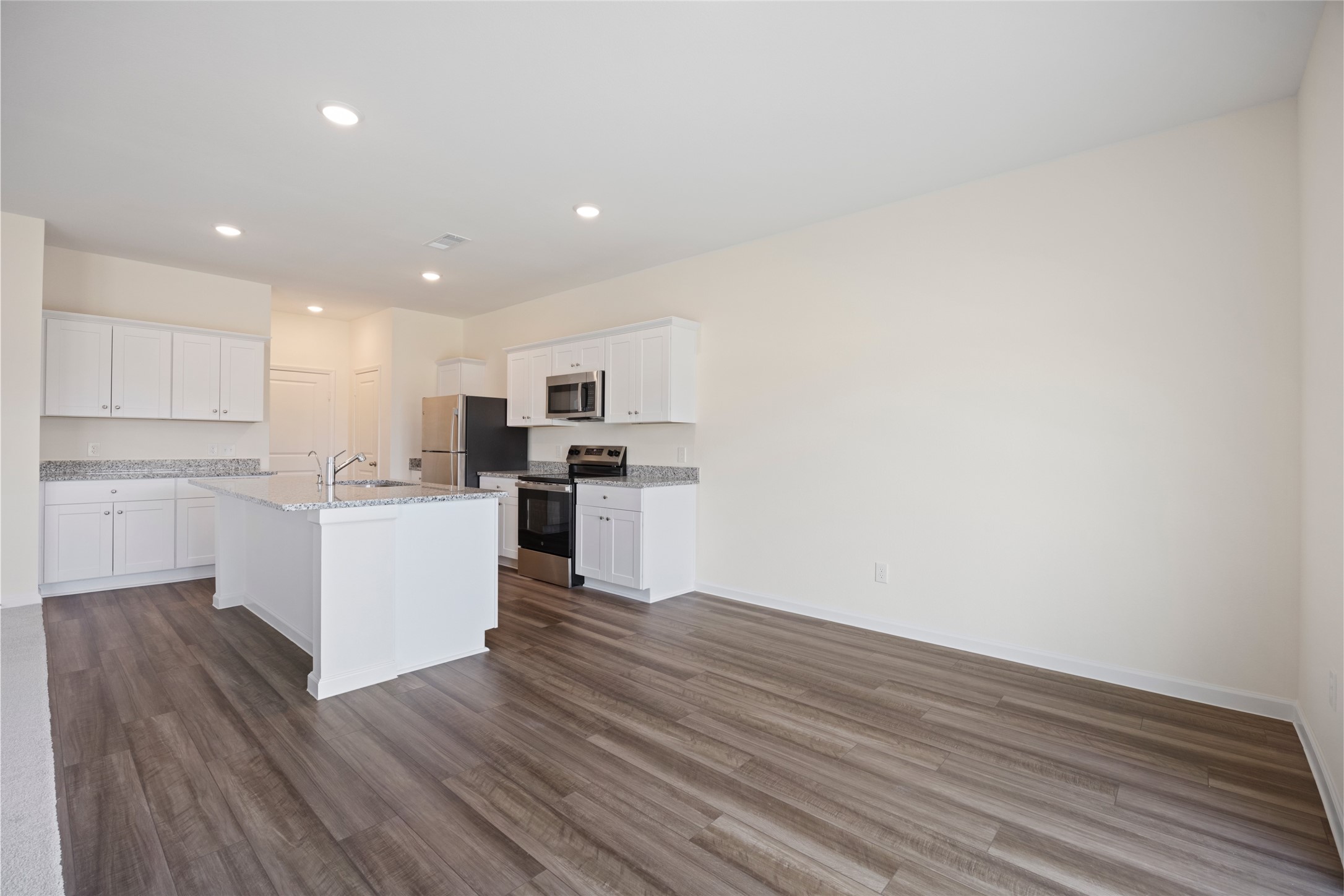 8807 Vacek Xing Way Richmond, TX 77469 - Photo 4 of 33 a view of kitchen with wooden floor