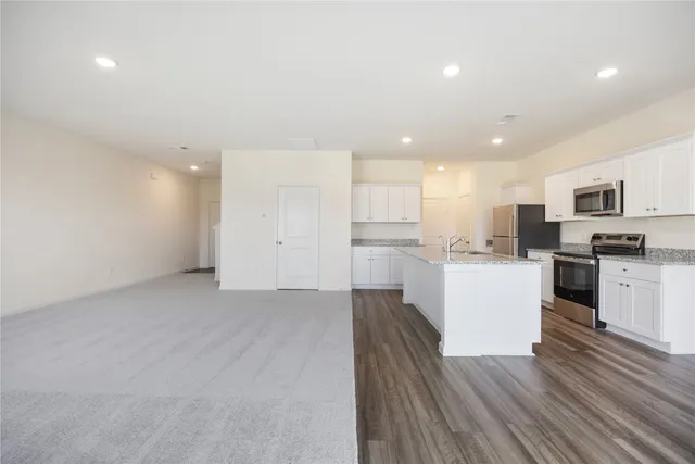 a view of kitchen with wooden floor
