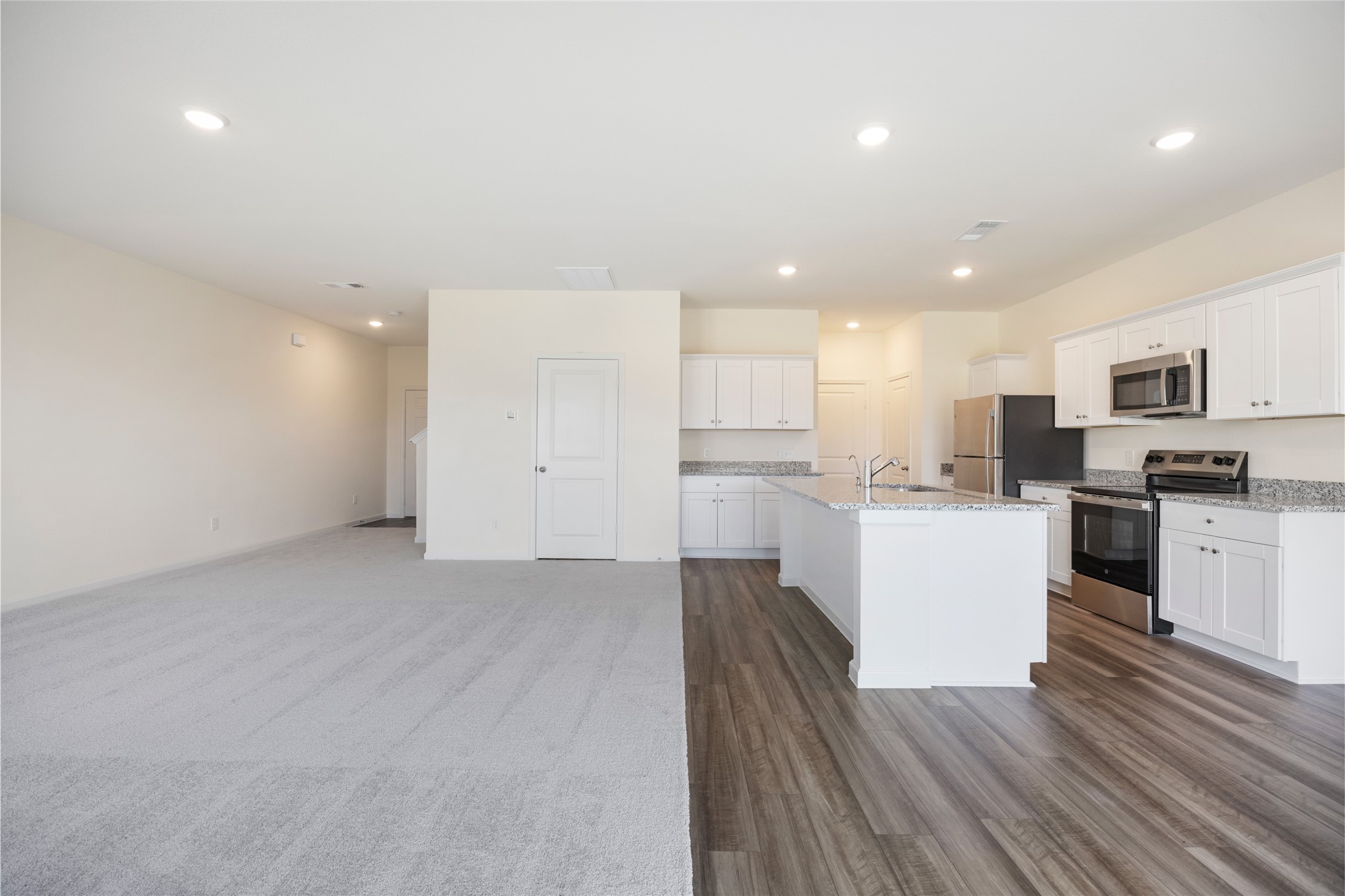 8807 Vacek Xing Way Richmond, TX 77469 - Photo 6 of 33 a view of kitchen with wooden floor