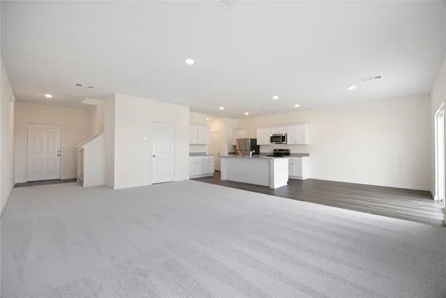 a view of a kitchen with a sink and a stove top oven