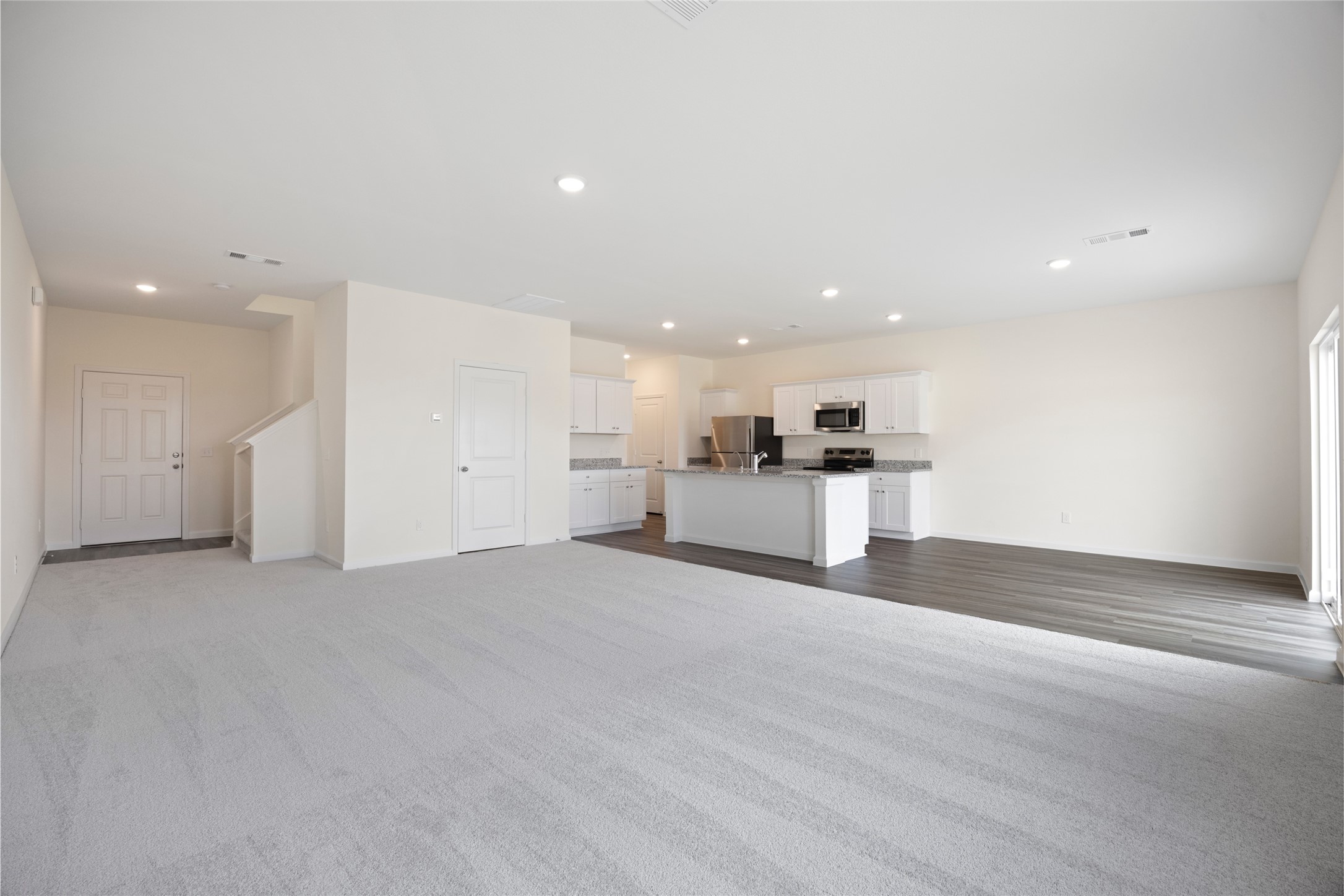 8807 Vacek Xing Way Richmond, TX 77469 - Photo 10 of 33 a view of a kitchen with a sink and a stove top oven