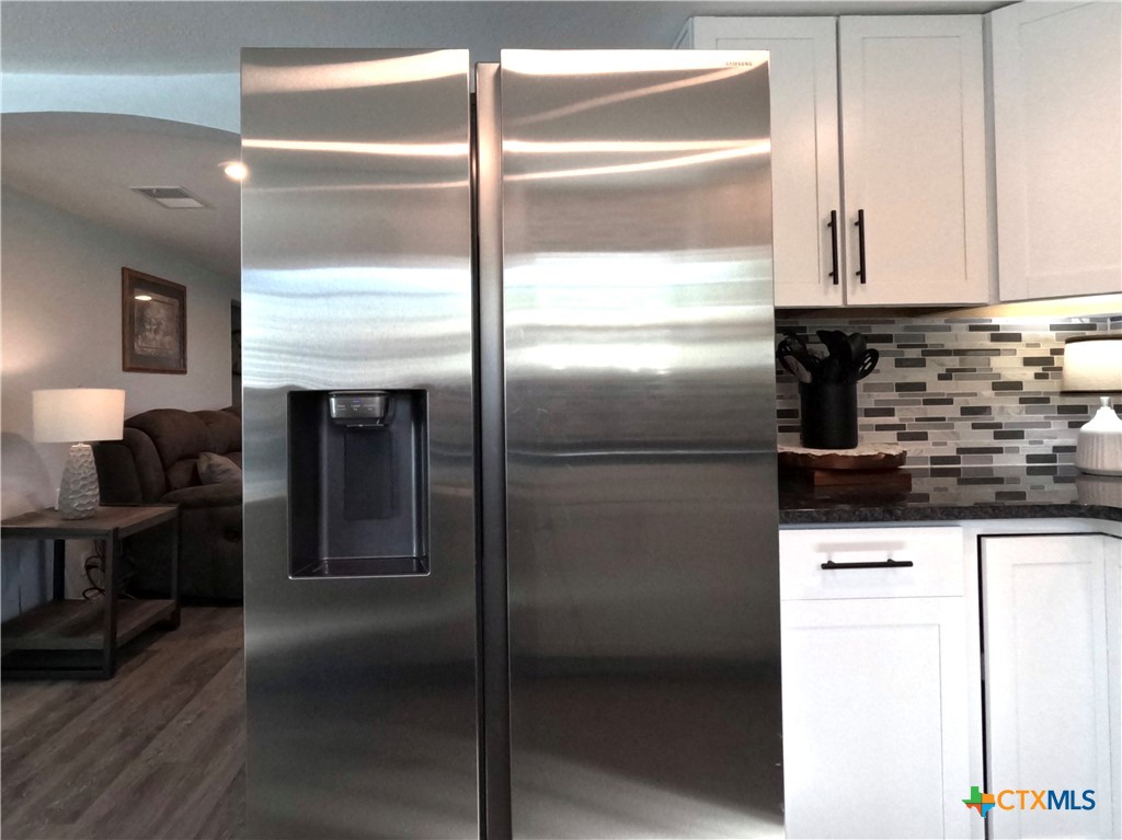 8 Marshall Road Port Lavaca, TX 77979 - Photo 14 of 31 a kitchen with granite countertop stainless steel appliances and refrigerator