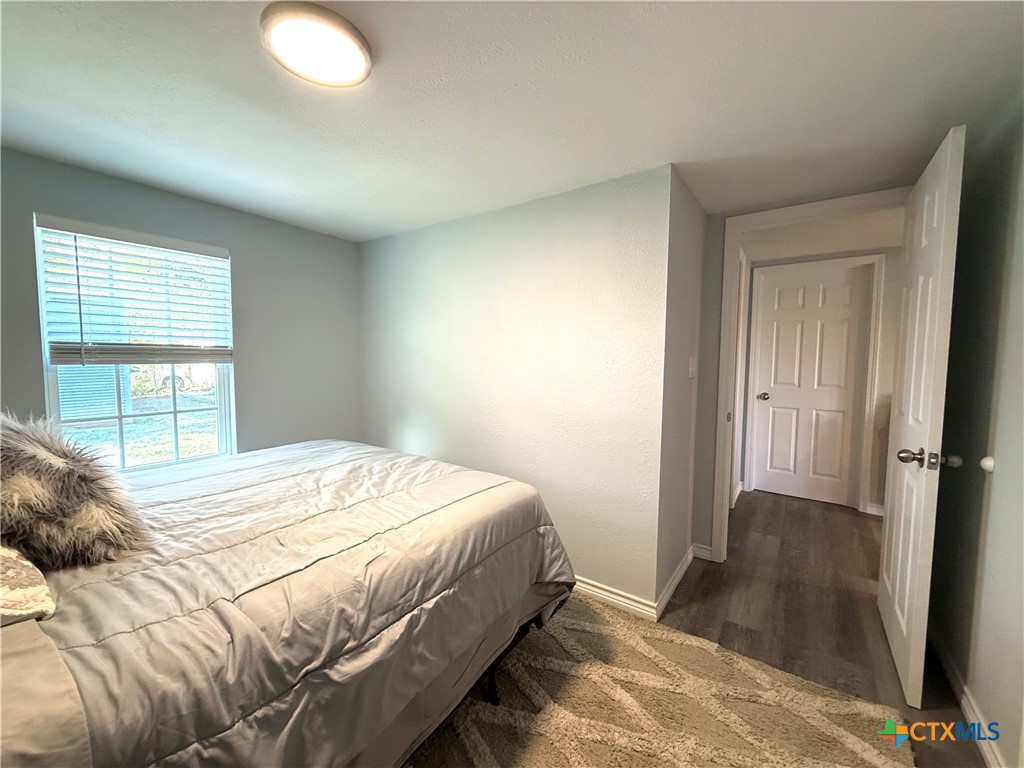 8 Marshall Road Port Lavaca, TX 77979 - Photo 16 of 31 a bedroom with a bed and a window