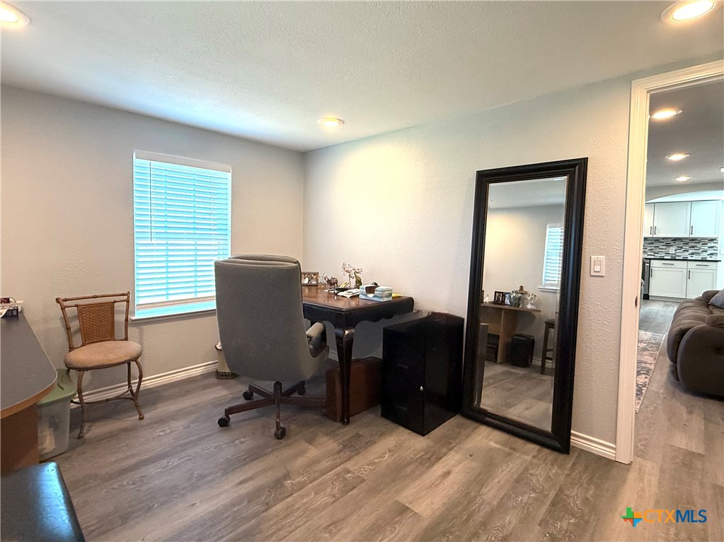 8 Marshall Road Port Lavaca, TX 77979 - Photo 26 of 31 a workspace with furniture and wooden floor