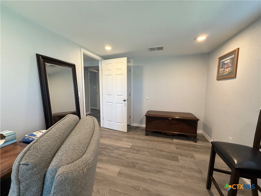 8 Marshall Road Port Lavaca, TX 77979 - Photo 27 of 31 a bedroom with a bed and a chair