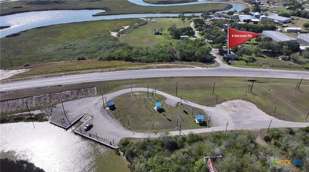 8 Marshall Road Port Lavaca, TX 77979 - Photo 3 of 31 an aerial view of a house with a yard and lake view