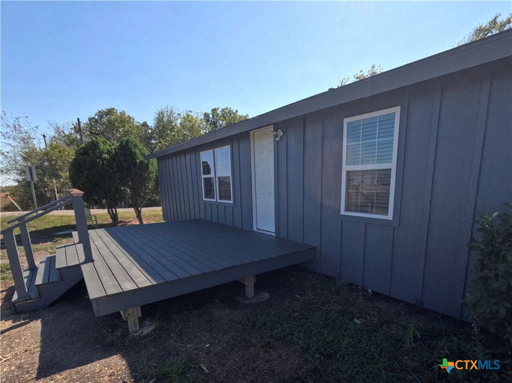8 Marshall Road Port Lavaca, TX 77979 - Photo 4 of 31 a wooden bench sitting in front of a house