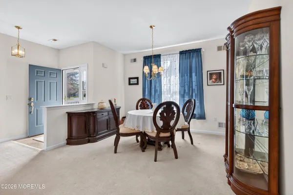 a dining room with furniture and window