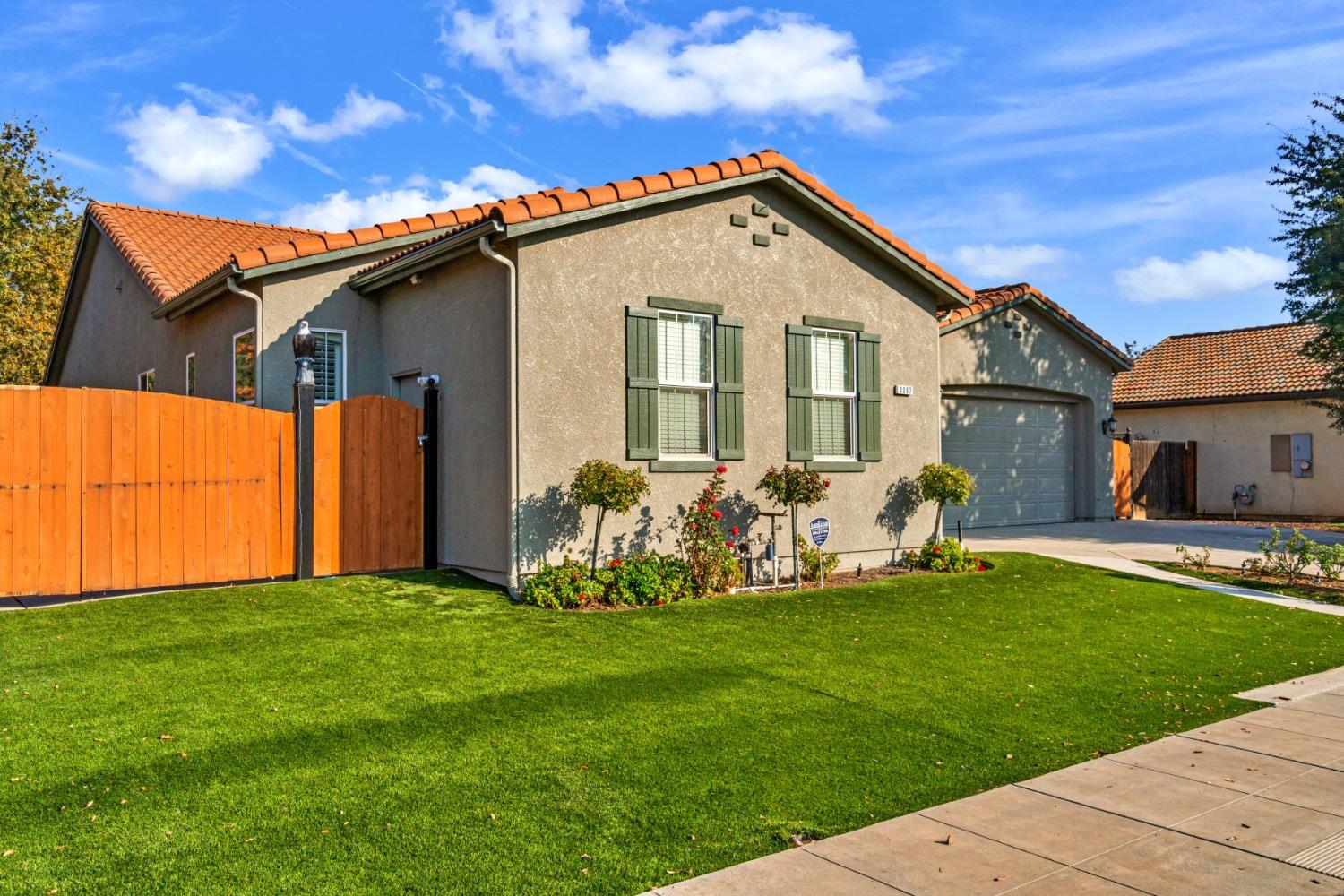 3307 Buckingham Avenue Clovis, CA 93619 - Photo 2 of 32 a front view of a house with a yard