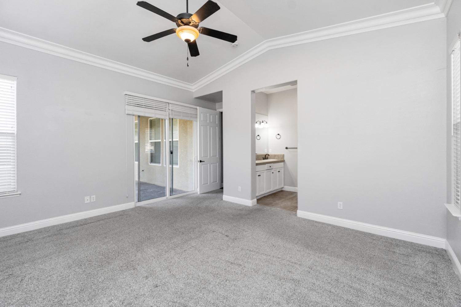 3307 Buckingham Avenue Clovis, CA 93619 - Photo 25 of 32 a view of a room with a ceiling fan and a window